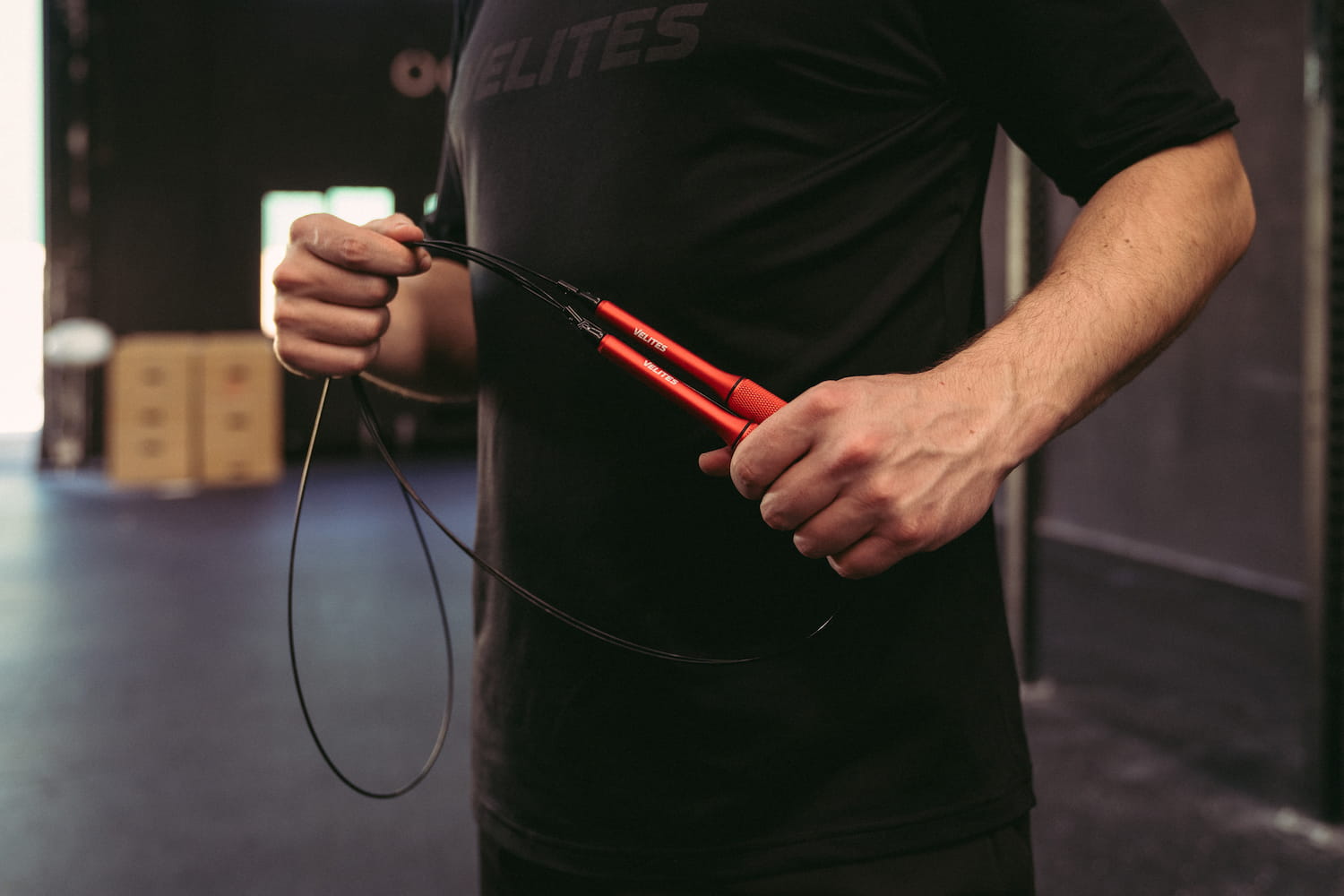 Adjusting jump rope double unders guy with Fire 2.0 Velites