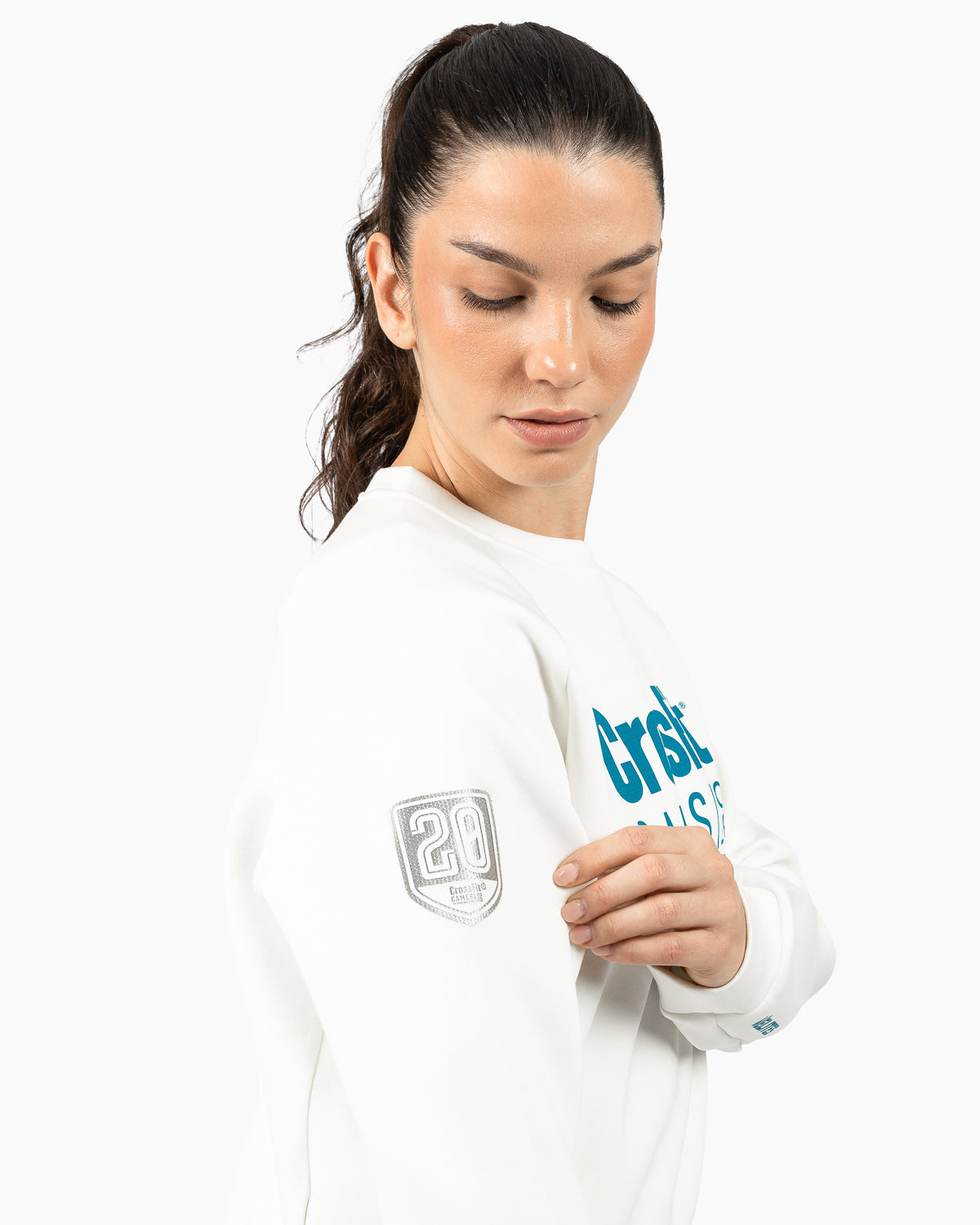 Close-up of the fit and retro chest graphic on the women's pearl crop sweatshirt